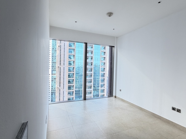 Bright bedroom with floor-to-ceiling window in Marina Gate 1